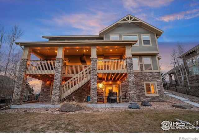 view of front of home with a patio and a yard