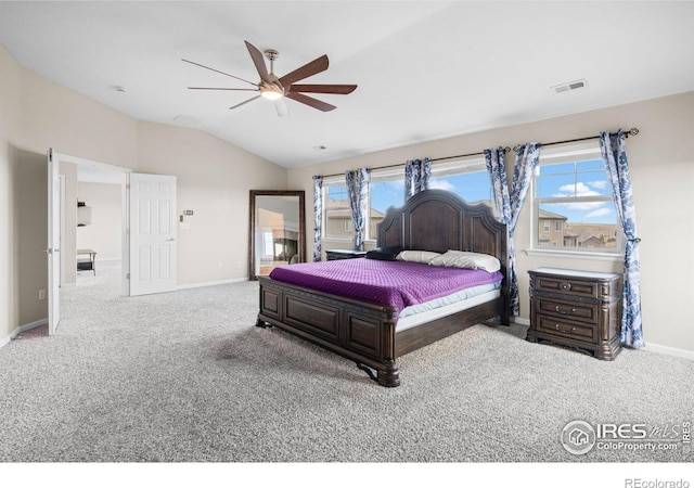 bedroom featuring lofted ceiling, light colored carpet, and ceiling fan