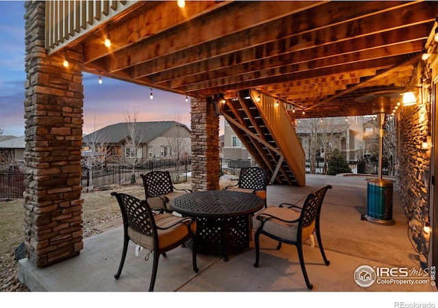 view of patio terrace at dusk