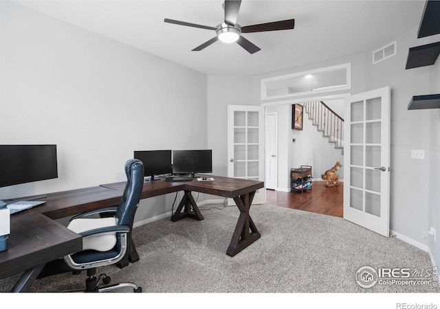 office area with french doors, dark carpet, and ceiling fan