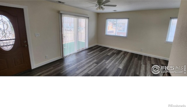 foyer with ceiling fan and dark hardwood / wood-style flooring