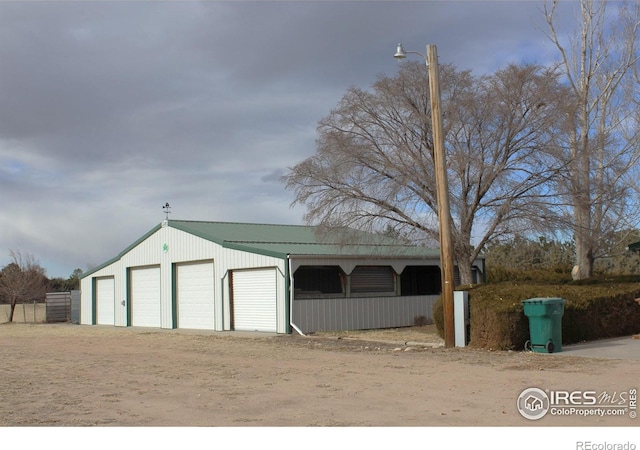 view of outdoor structure with a garage