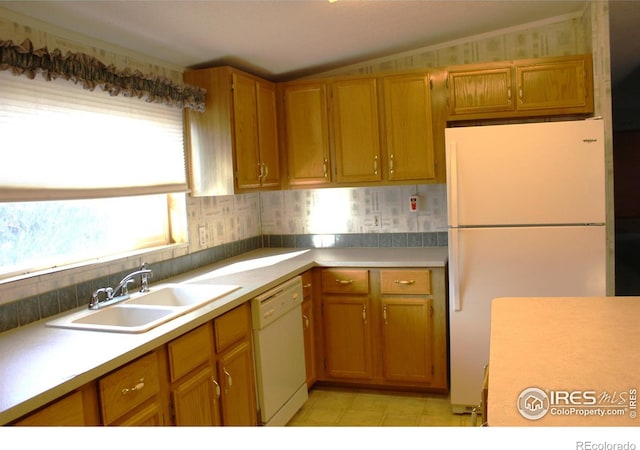 kitchen with sink and white appliances