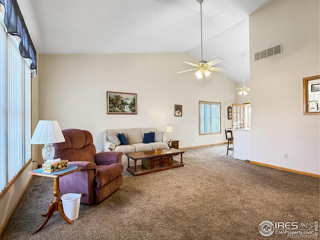 carpeted living room featuring ceiling fan and high vaulted ceiling