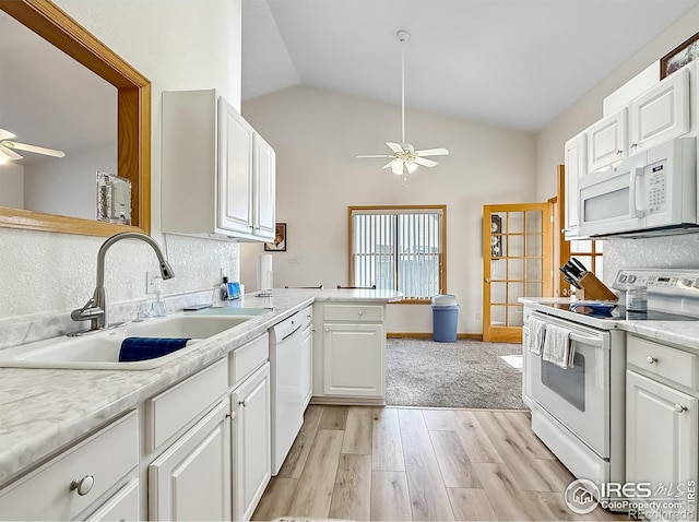 kitchen featuring ceiling fan, sink, white cabinets, and white appliances