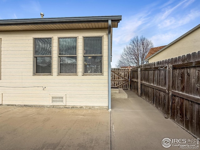 view of side of property with a patio