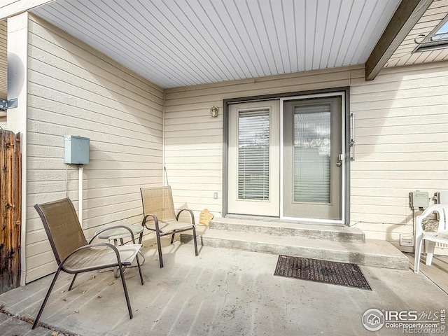 entrance to property featuring a patio