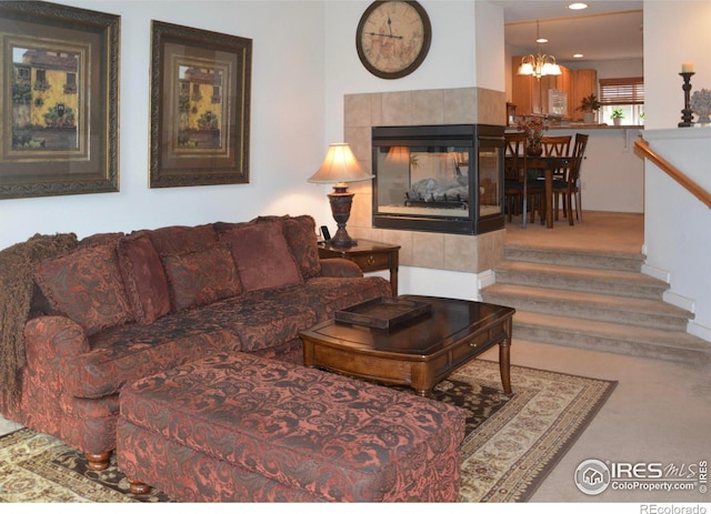 living room featuring a fireplace and carpet flooring