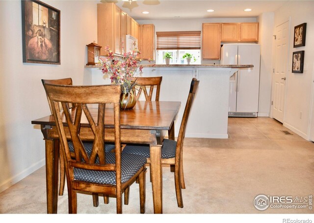 view of carpeted dining area