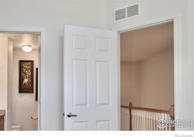 interior space featuring toilet and vanity