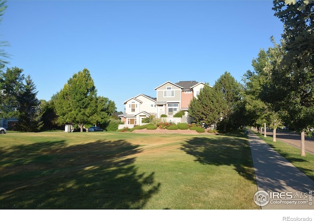 view of front of home with a front yard