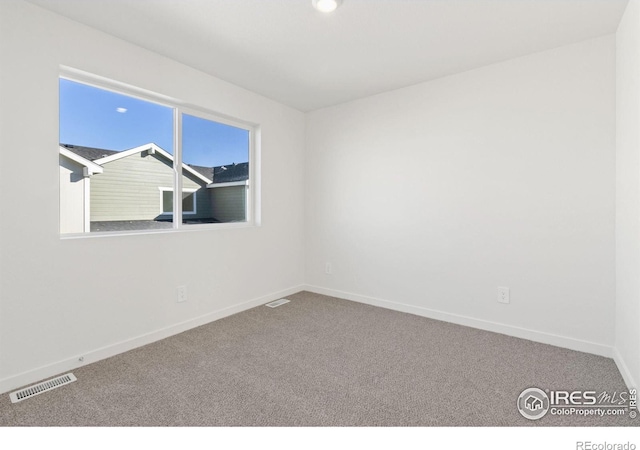 empty room featuring carpet flooring