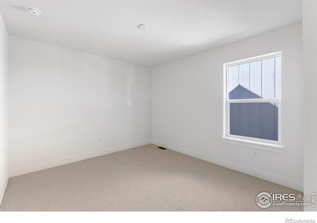 empty room with carpet floors