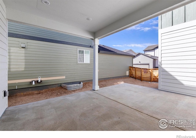 view of patio / terrace with a garage