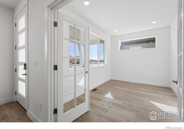 doorway to outside with light hardwood / wood-style flooring