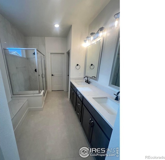 bathroom featuring walk in shower and vanity