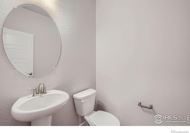 bathroom with sink and toilet