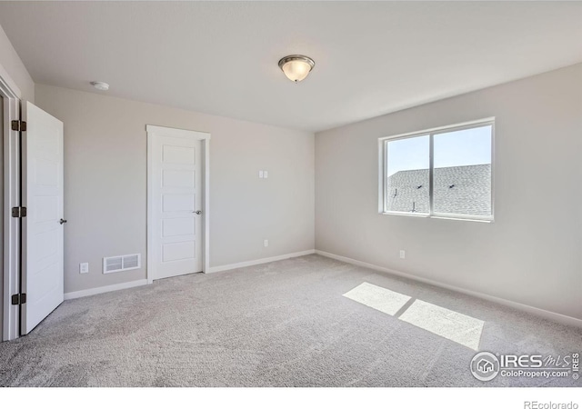 view of carpeted spare room