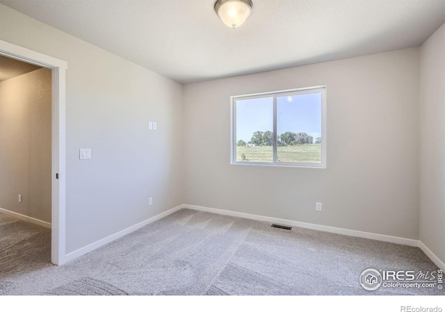 unfurnished room featuring carpet floors