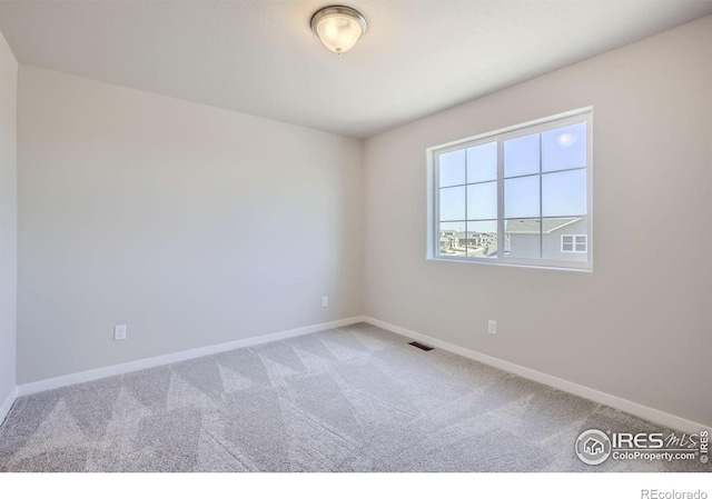 view of carpeted spare room