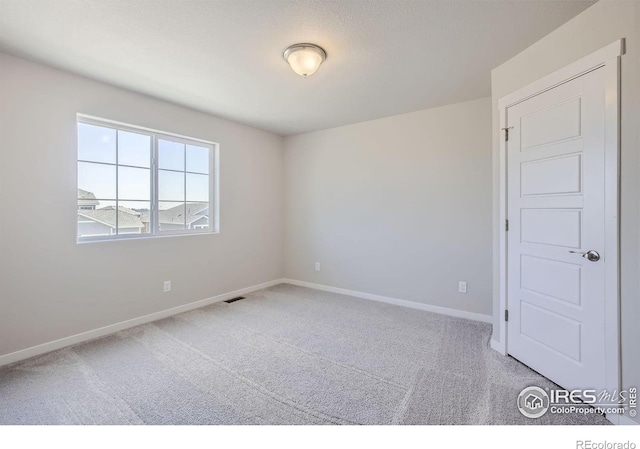 view of carpeted spare room