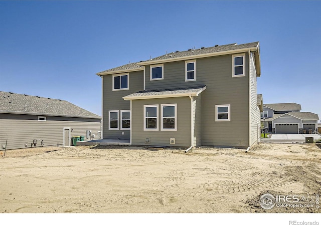 back of property with a patio area