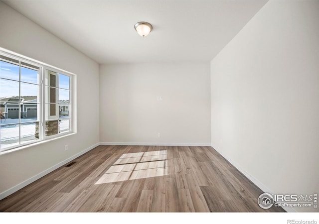 empty room with light wood-type flooring