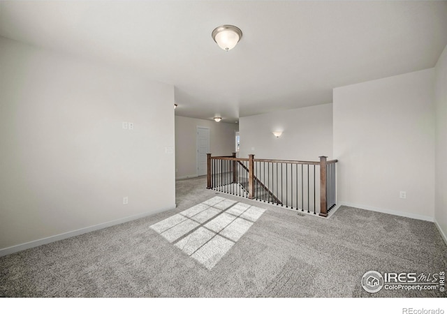 unfurnished room with light colored carpet