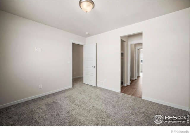 unfurnished bedroom with carpet floors