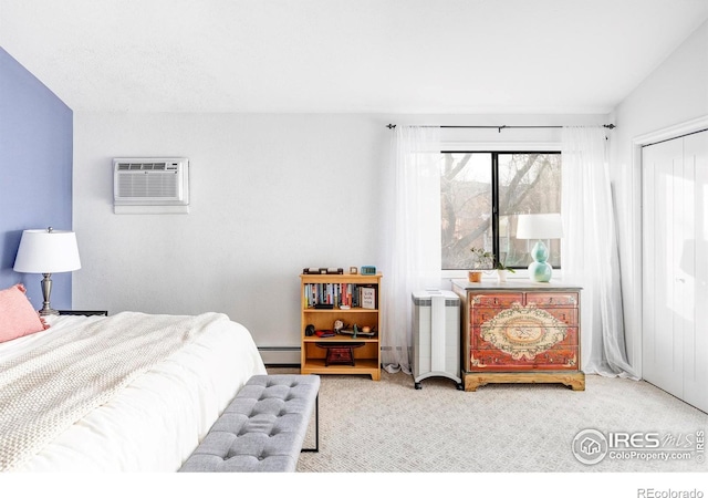 bedroom with a baseboard heating unit, an AC wall unit, vaulted ceiling, light carpet, and a closet