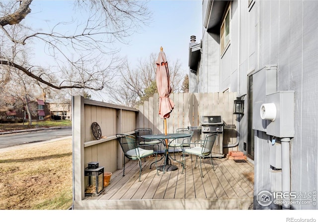 wooden terrace featuring area for grilling