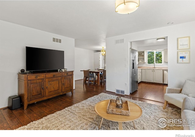 living room featuring dark hardwood / wood-style flooring