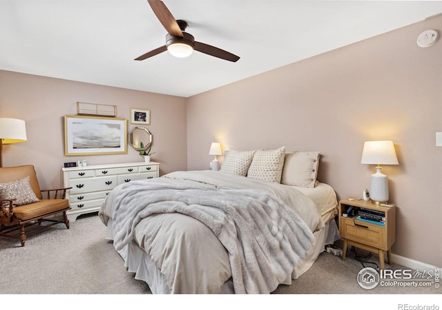 bedroom featuring ceiling fan and light carpet