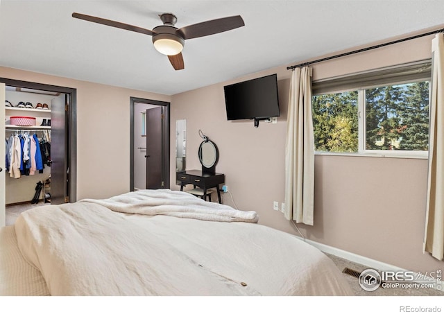 bedroom with ceiling fan and a closet