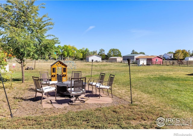 view of yard with a patio and a playground