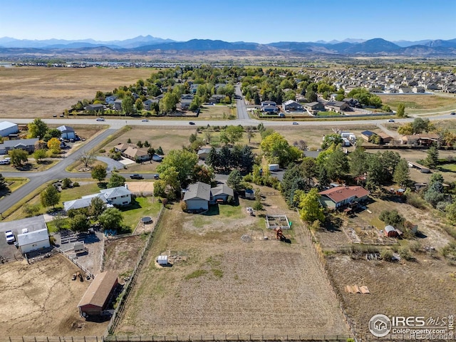 birds eye view of property with a mountain view