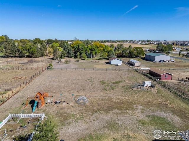 birds eye view of property with a rural view