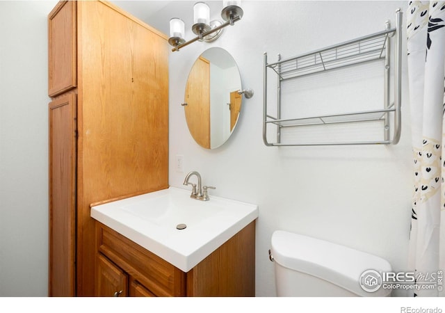 bathroom with vanity and toilet