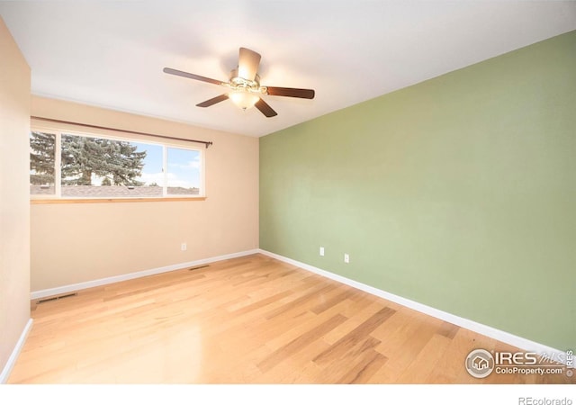 unfurnished room featuring light hardwood / wood-style flooring and ceiling fan