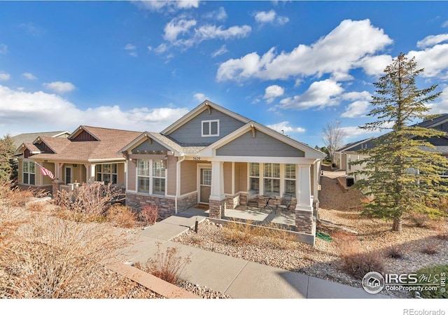 craftsman inspired home featuring covered porch