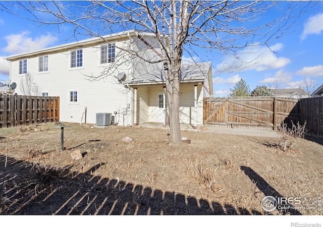 back of house featuring central AC