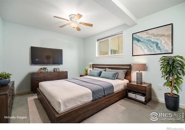 bedroom featuring light carpet, ceiling fan, and baseboards