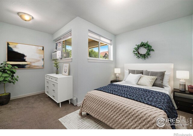 bedroom with carpet flooring and baseboards