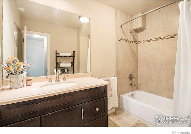 bathroom featuring shower / bath combo with shower curtain and vanity