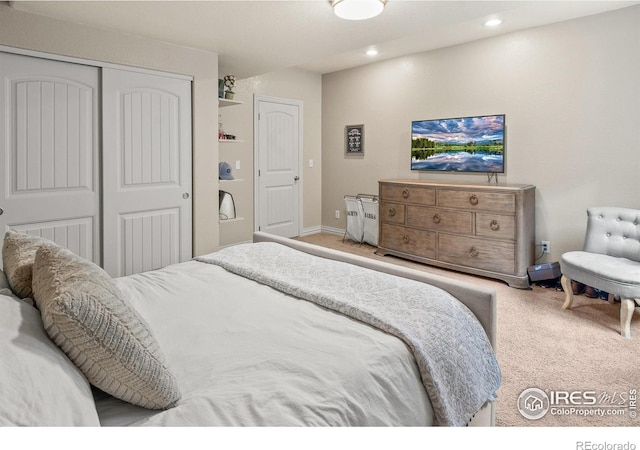 bedroom with a closet and carpet