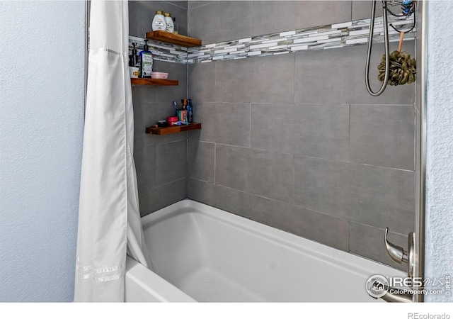 bathroom featuring shower / bathtub combination with curtain