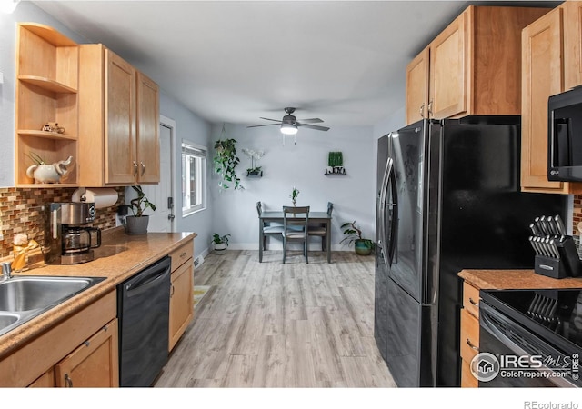 kitchen featuring black appliances, sink, ceiling fan, tasteful backsplash, and light hardwood / wood-style floors