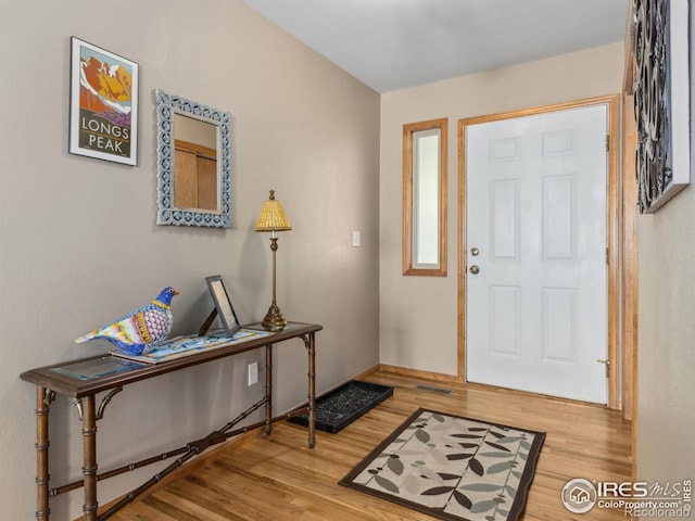 entryway with hardwood / wood-style flooring