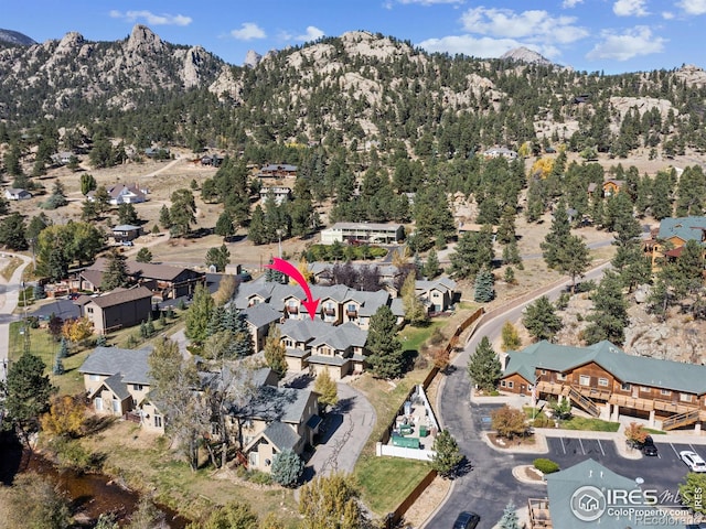 birds eye view of property featuring a mountain view