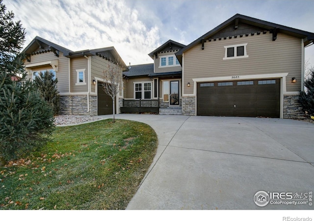 view of front of home featuring a garage and a front lawn